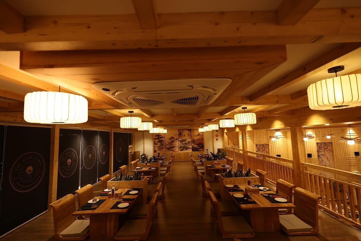 Timber beams and lantern light overhead